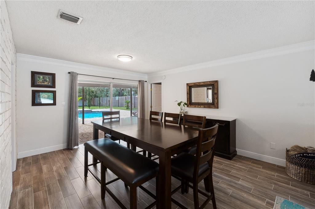 Spacious dining room with pool views!