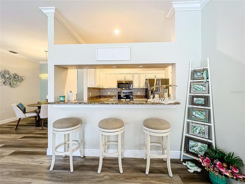 Another view of the breakfast bar with the pass through to the kitchen.