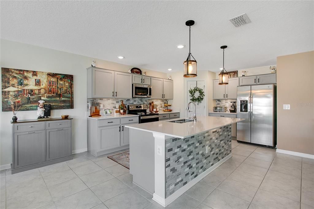 Kitchen w/ Island + Breakfast Bar