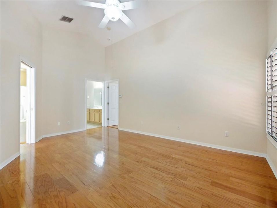 Primary Bedroom, Hard wood floors, High Ceilings, Plantation Shutters