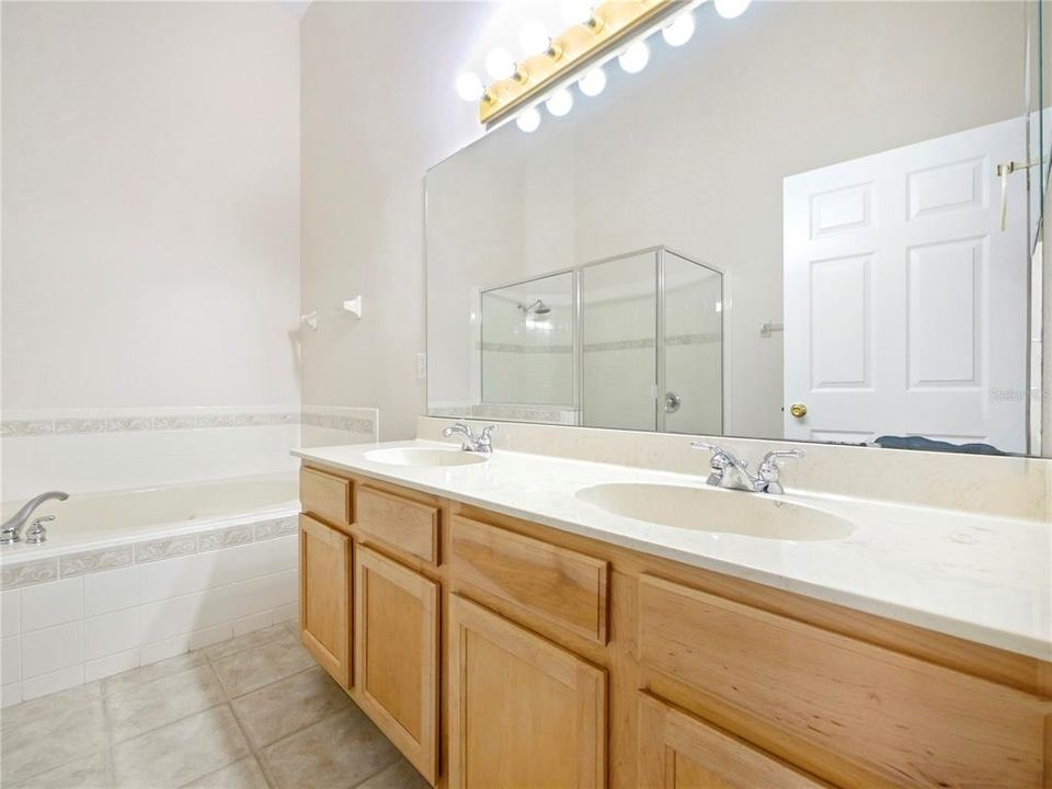 Primary Bath, tile floor, soak tub and walk in shower, dual sink vanity