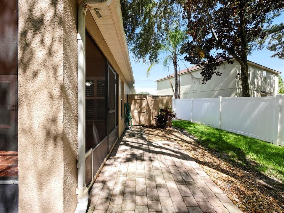 Side yard with tool shed area.