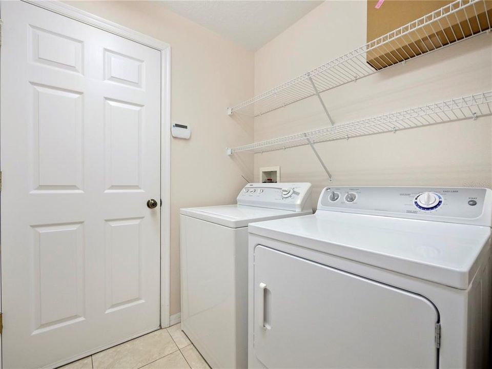 Utility Room, Washer and Dryer, Storage. Door leads to the two car garage.