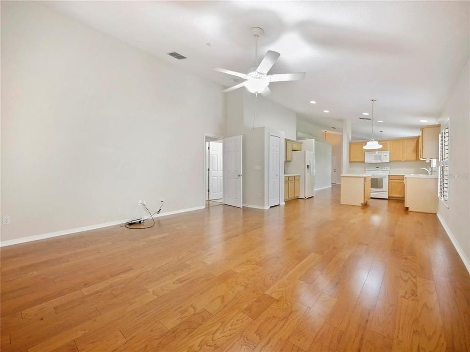 Family Room, looking onto the Kitchen. Plantations Shutters, Hardwood Flooring, Cable High Speed Feed