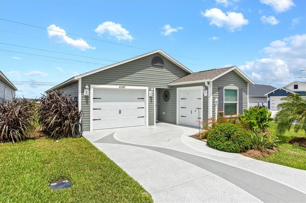 FRONT OF HOME GARAGE, GOLF CART GARAGE & INCLUDED GOLFCART