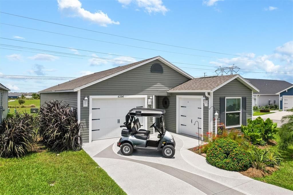 FRONT OF HOME GARAGE AND GOLF CART CARAGE