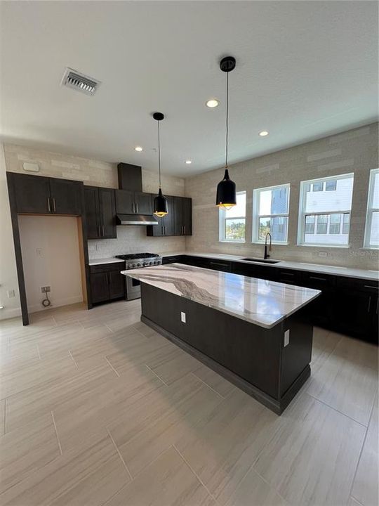 Kitchen - Brown cabinets with gold hardware