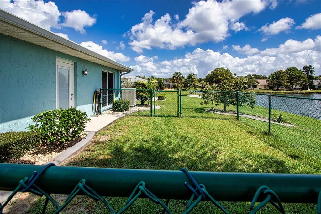 Small fenced area with access door into kitchen area