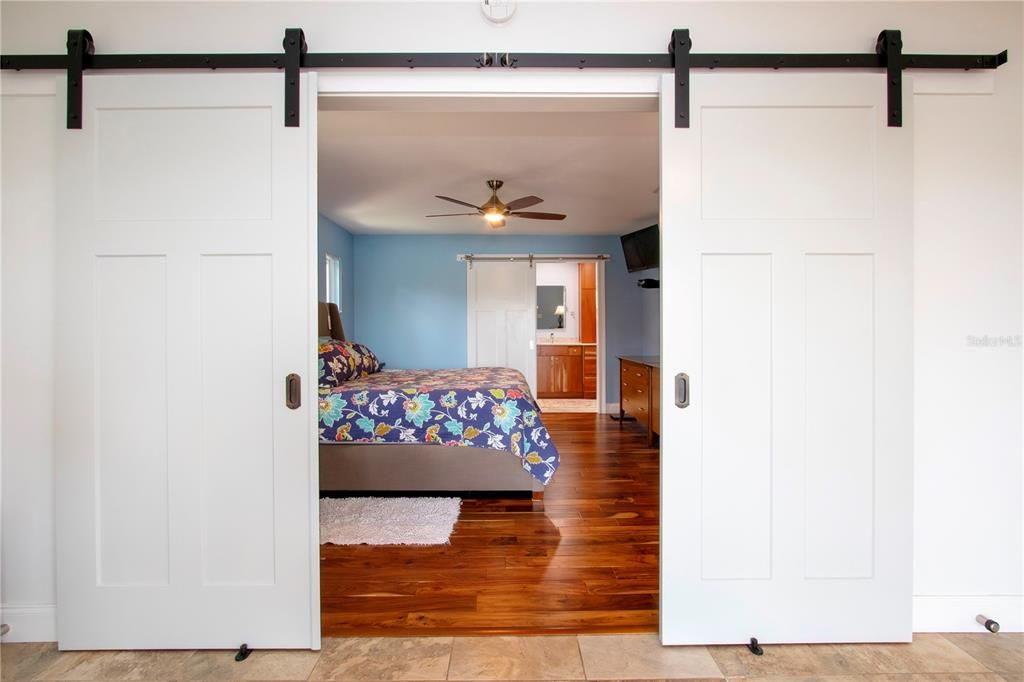 Barn door to primary bedroom