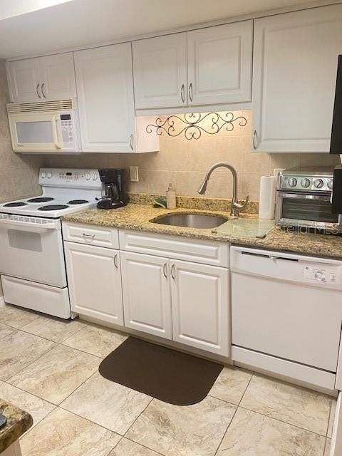 Kitchen sink area, and more storage drawers