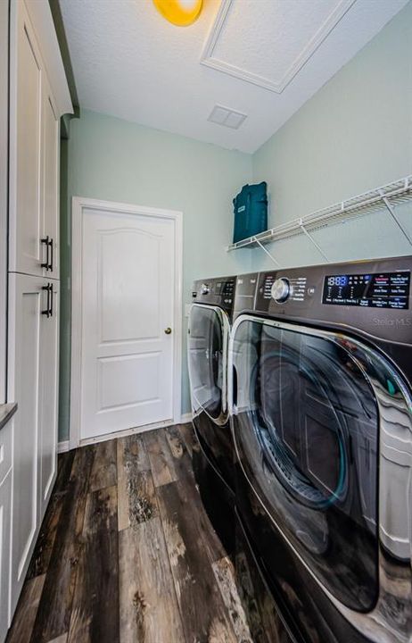 Butler's Pantry with drawers, utility sink, & Inside laundry.