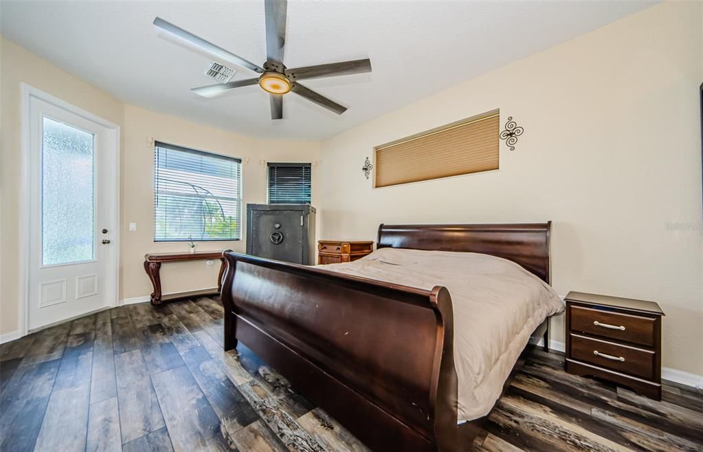 Spacious Master Bedroom on first floor with door leading to Lanai.