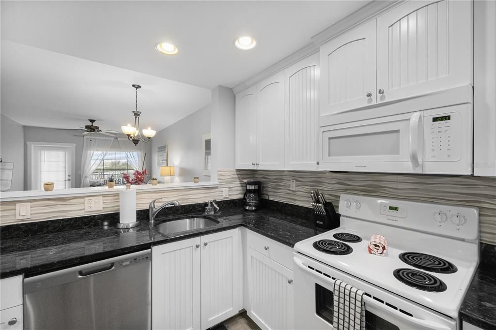 Kitchen fully stocked with cooking/eating utensils