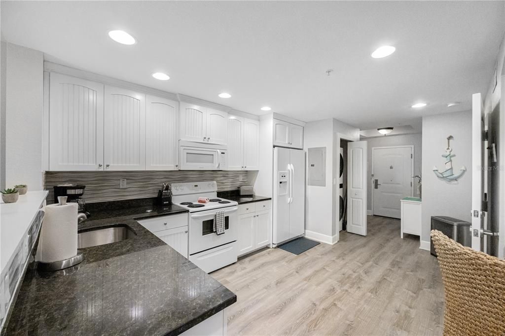 Kitchen fully stocked with cooking/eating utensils