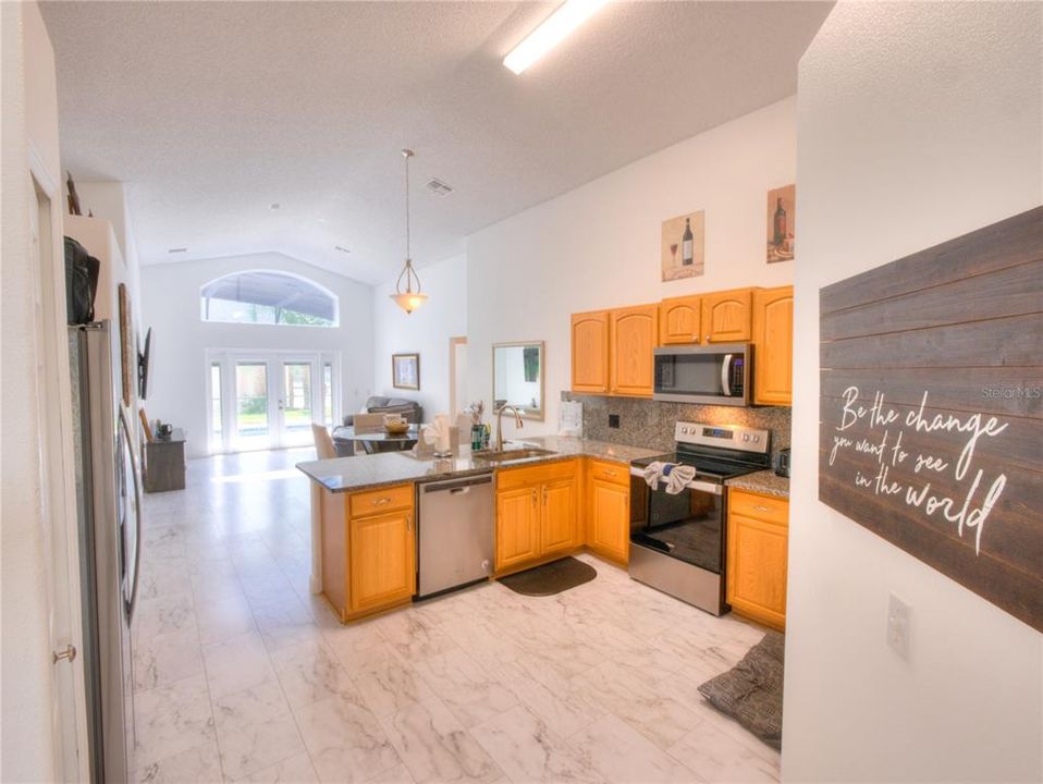 Granite Kitchen Countertops w/ Backsplash and stainless steel appliances