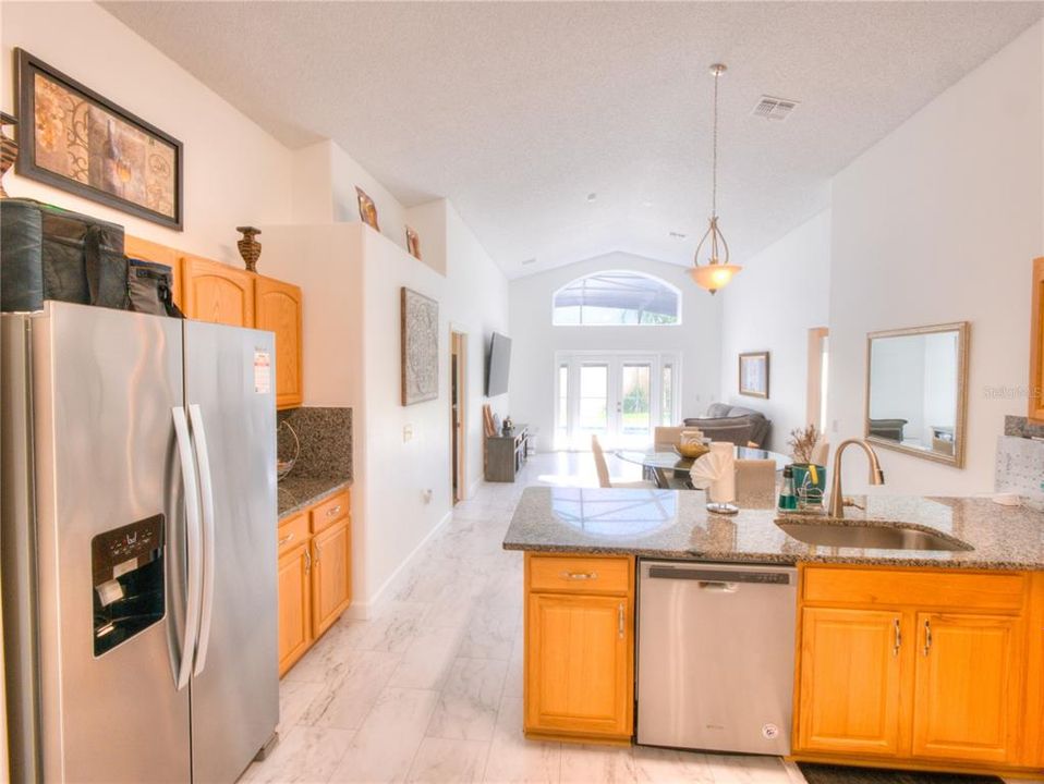 Granite Kitchen Countertops w/ Backsplash and stainless steel appliances