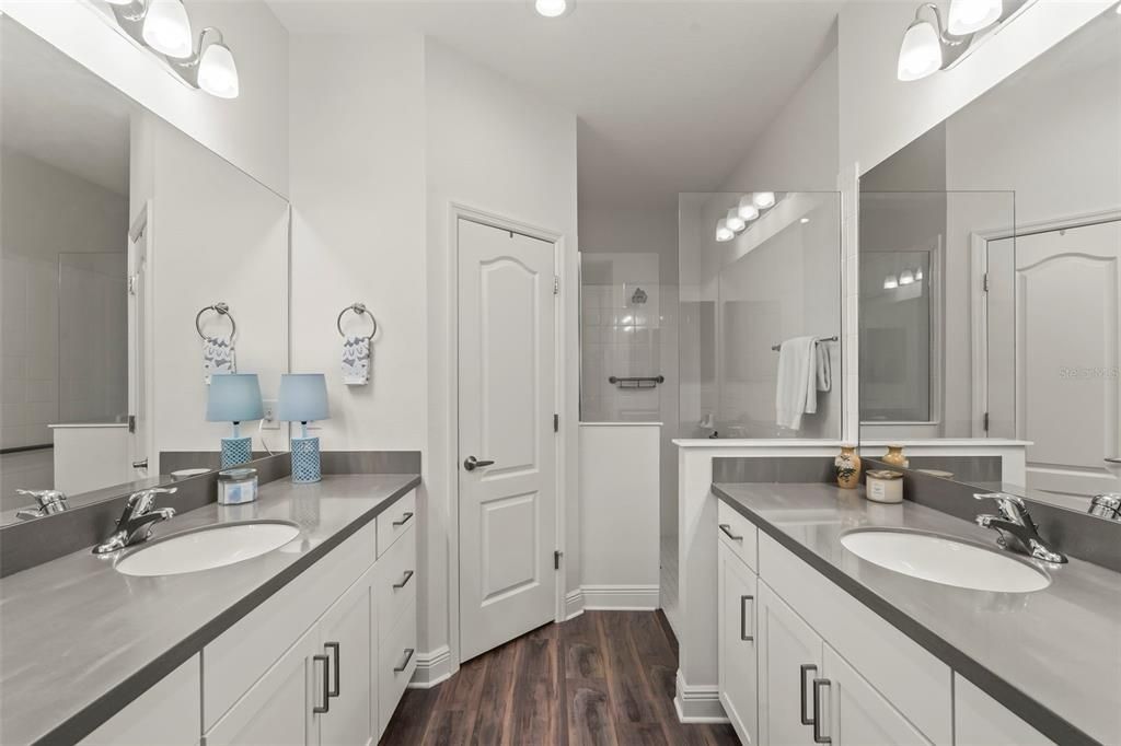 Quartz counters and love that walk-in shower!