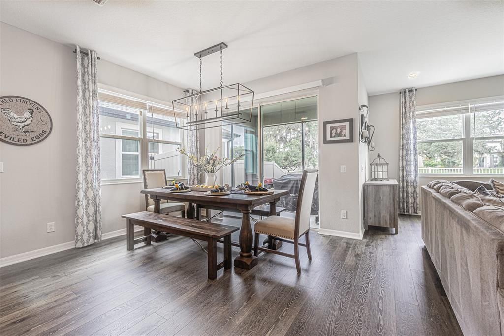 Bright and spacious dining area with upgraded light fixture