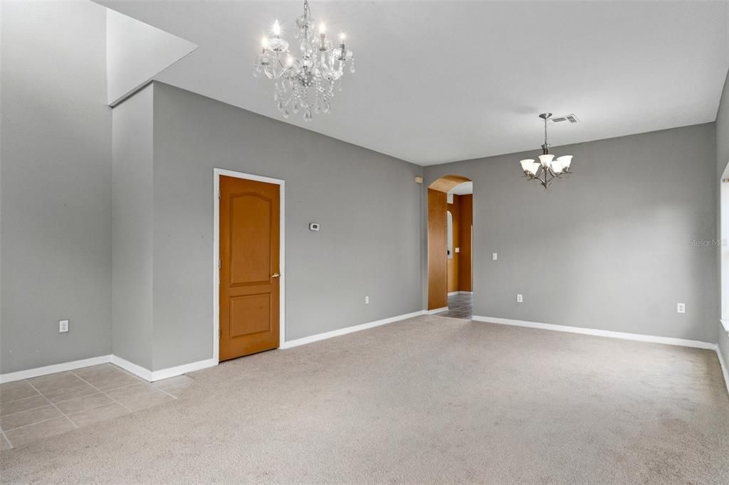 The Door for the half bathroom is located in the formal living room