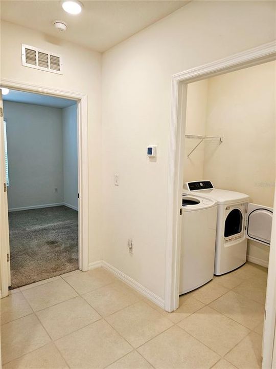 Hallway to front door, garage, laundry and 3 bedrooms