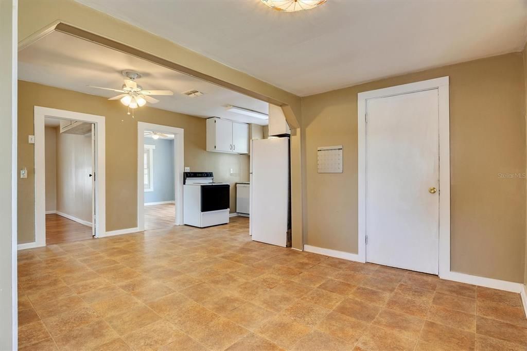 Dinning Area, Open Door into Owner Suite &  Closed Door into the Laundry Room