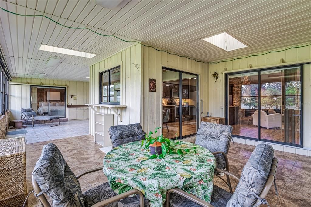 Enclosed porch under roof! 650 additional square feet with window AC unit!