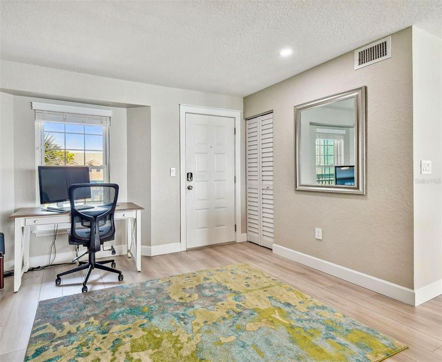 Entry space with desk by the window