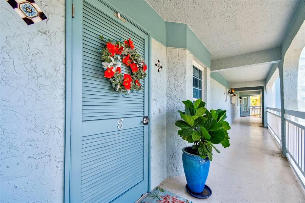 Shutter door allows cross breezes to condo