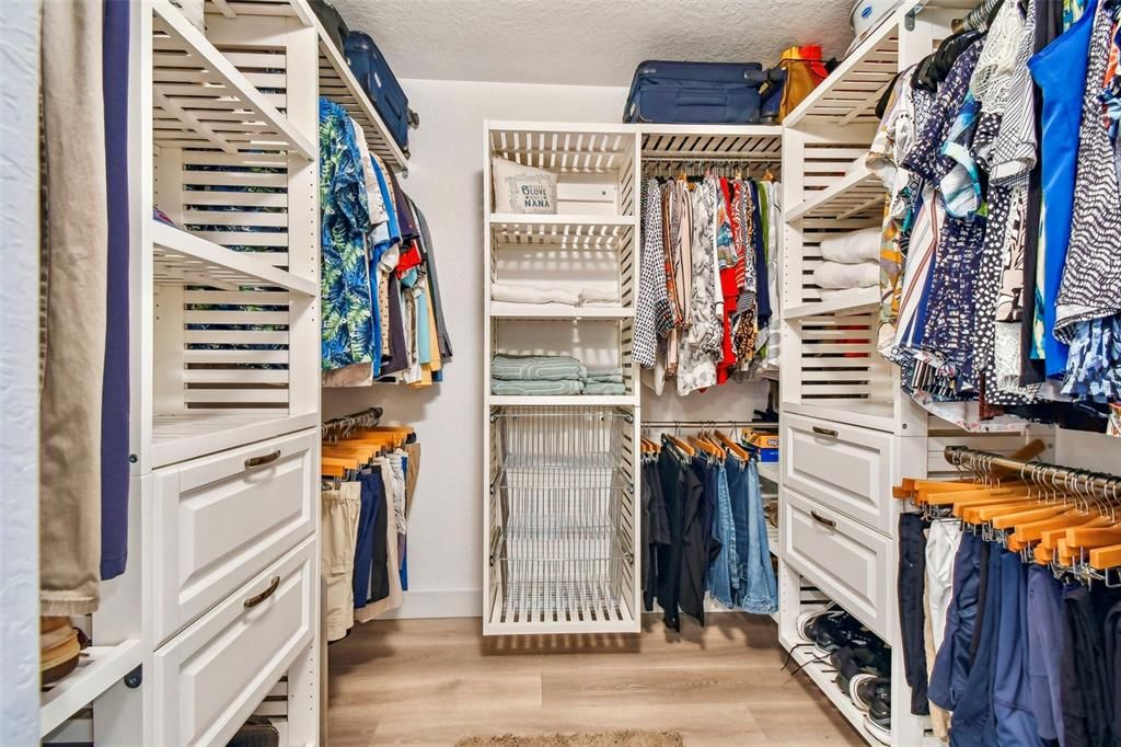 Large walk-in closet with custom cabinetry