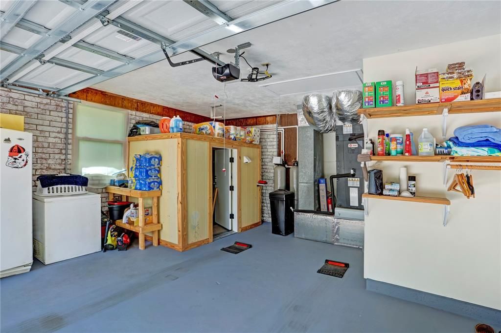 Attached garage - notice the water softner and the safe room?