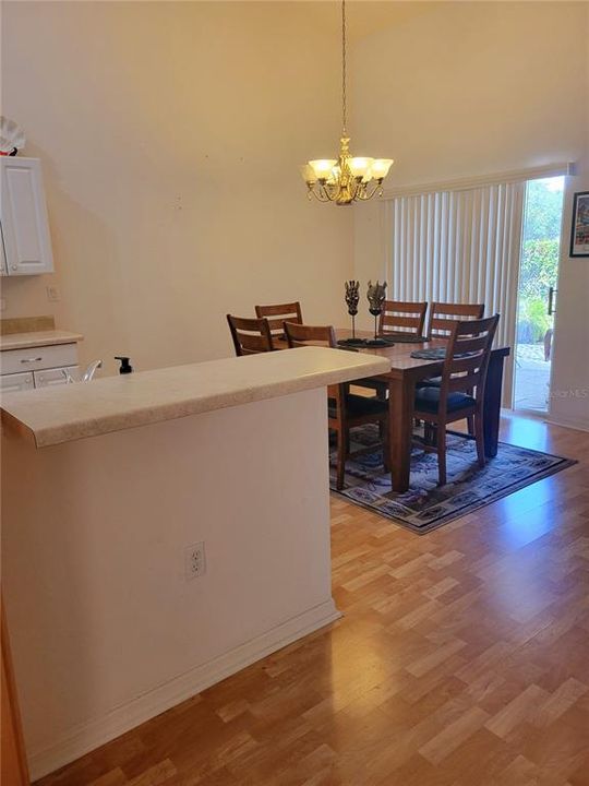 Dining Room has sliders with view of the Covered Lanai