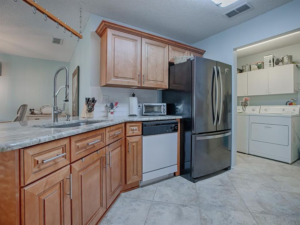 Deep double stainless steel sink, new faucet and granite countertop