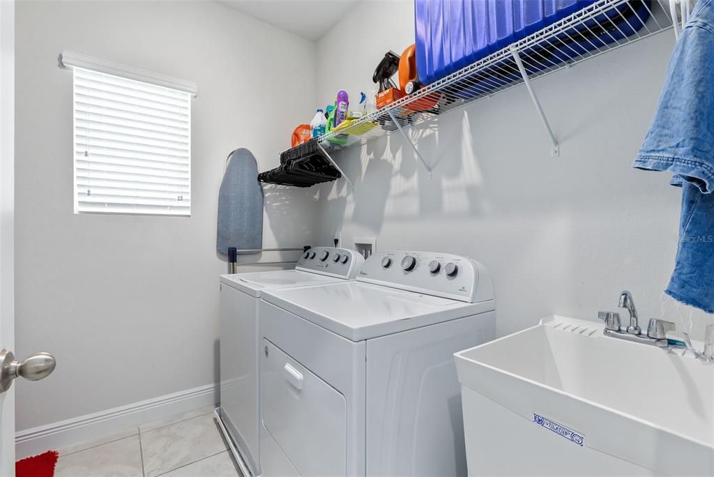 For added convenience, the laundry room includes a utility sink and is situated on the second floor.