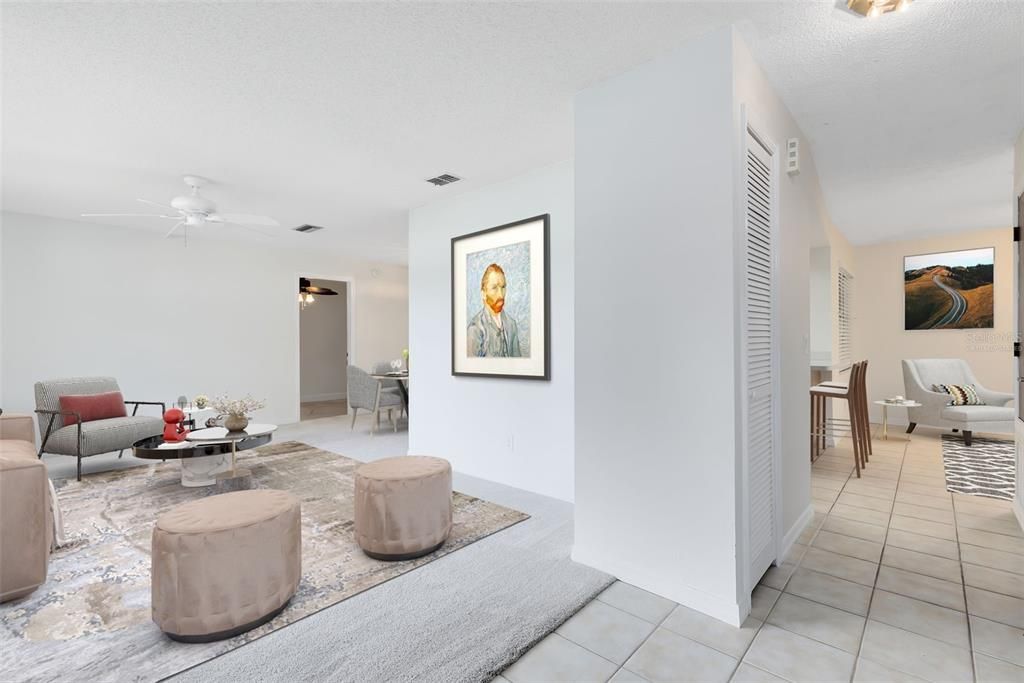 This photo has been virtually staged. Upon entry, you'll be greeted by the inviting formal living and dining spaces, boasting great natural light that enhances the warmth of the home.