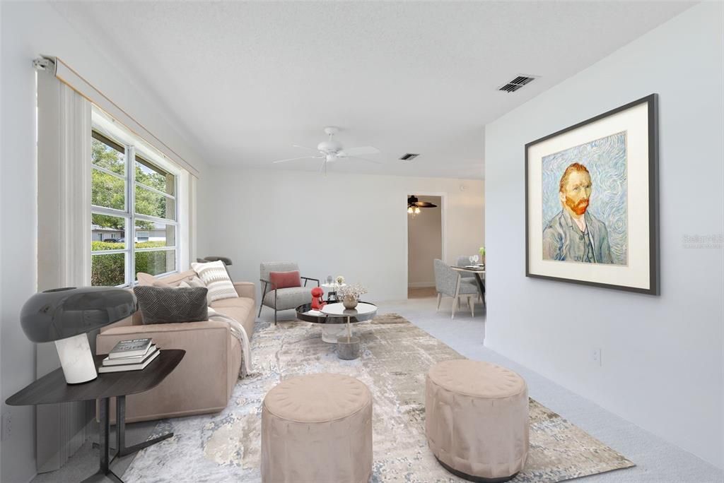 This photo has been virtually staged. Upon entry, you'll be greeted by the inviting formal living and dining spaces, boasting great natural light that enhances the warmth of the home.