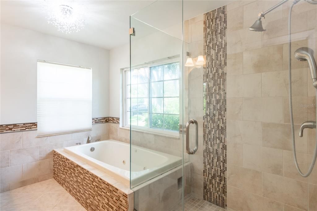 Soaker tub and stand-up shower.