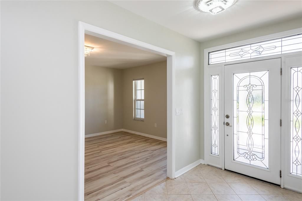 Stunning front door brings in lots of natural light!