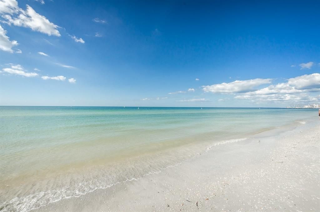 Steps to the Stunning White Sandy Beaches & Aquamarine Seascapes.