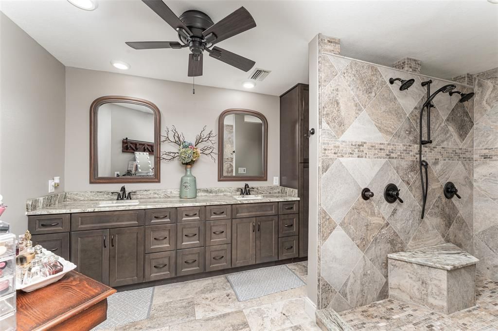 Updated, custom shower, cabinets, and granite countertops.