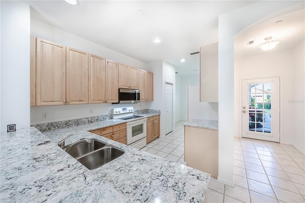 Kitchen with Quartz countertops and 42" raised cabinets