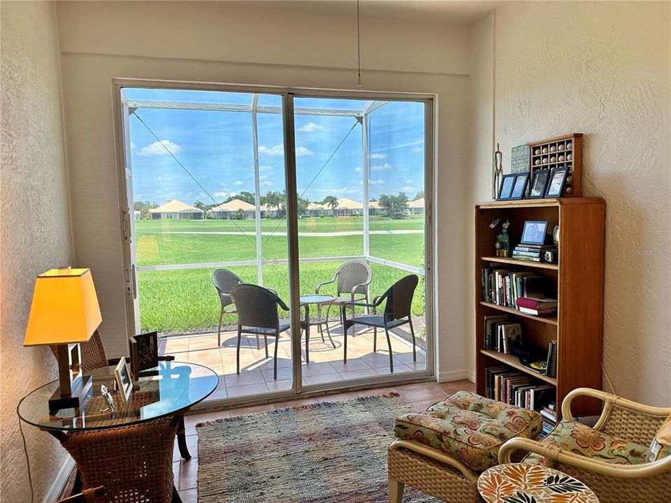 Florida Room with slider's leading to the tiled lanai - before the seller's moved out