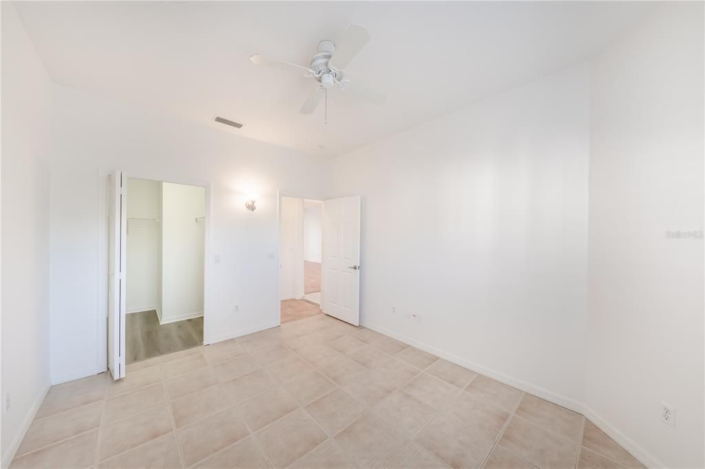 Guest Bedroom with view of walk-in closet