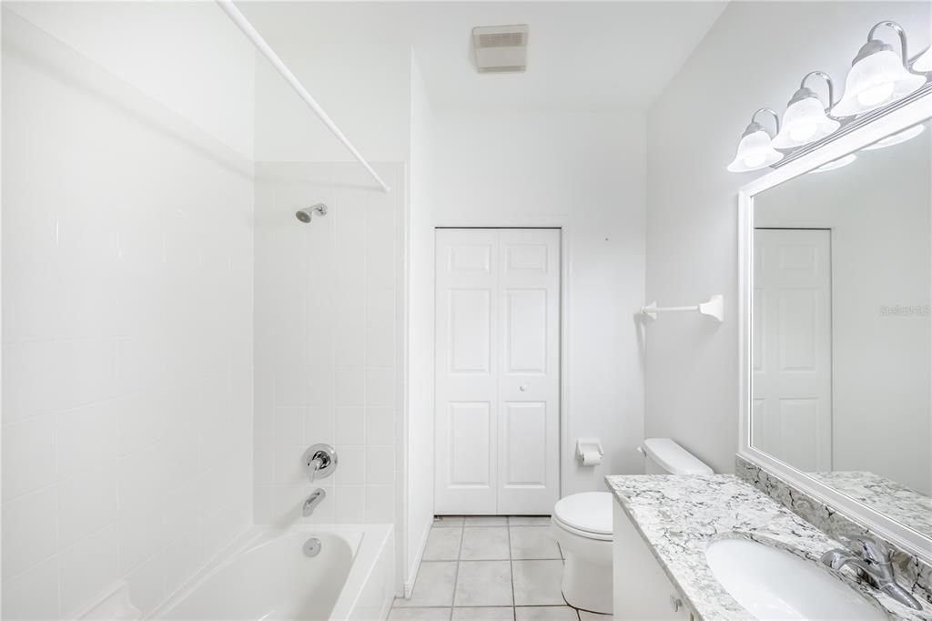 Guest Bath with Quartz countertops.  ANOTHER CLOSET!