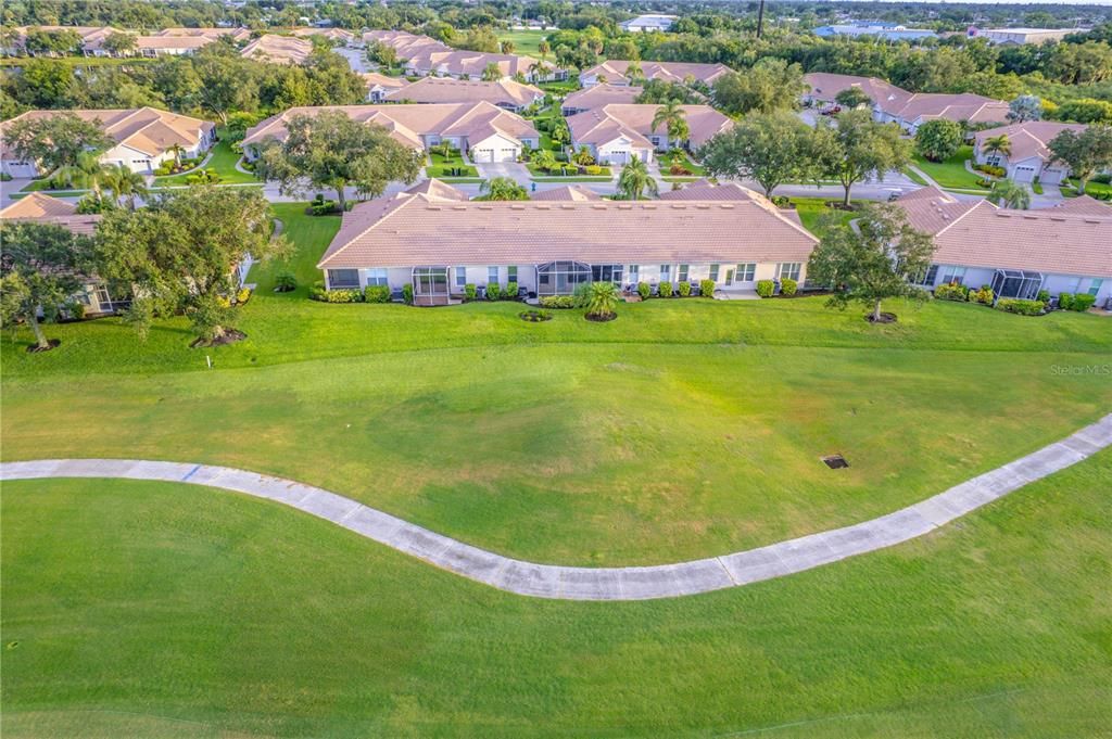 View of the back of the villas along the golf course - 635 Back Nine is the second one on the left (with the extended lanai)