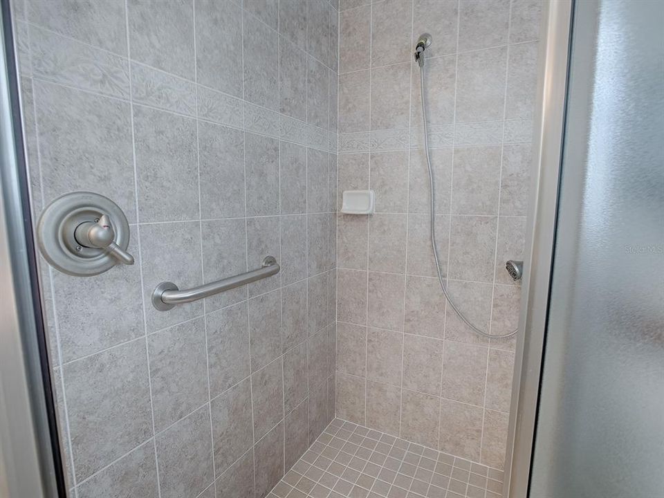 LOVELY TILED SHOWER.