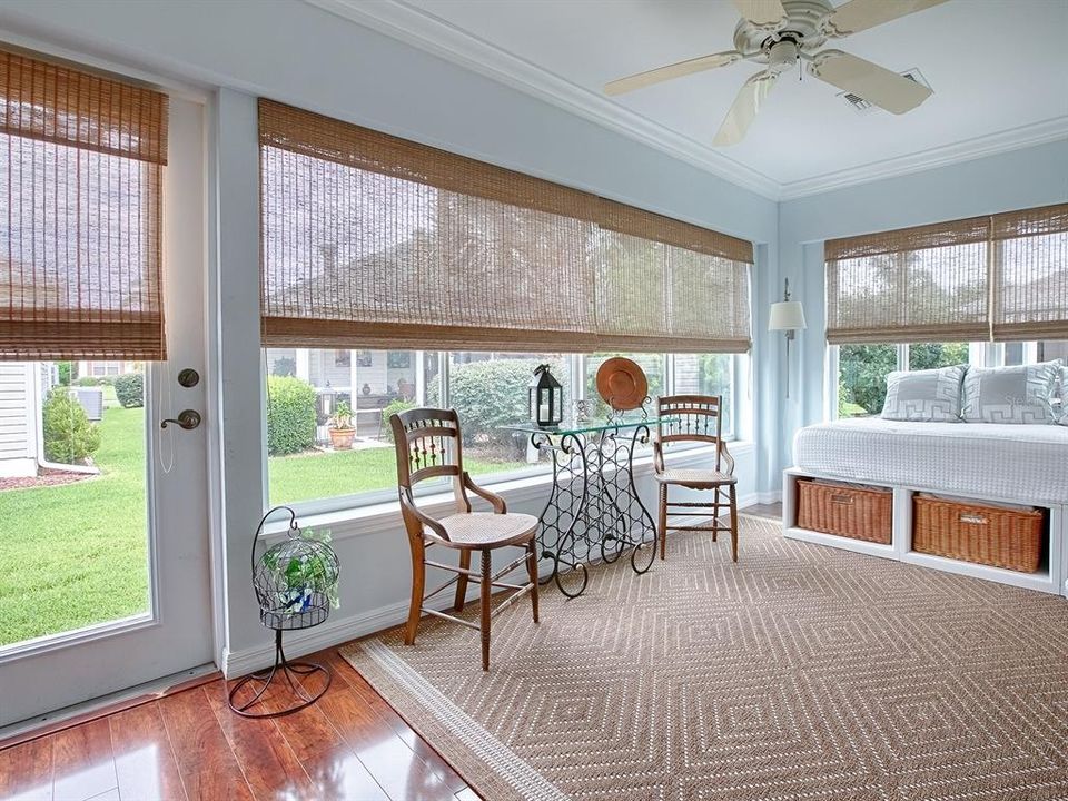 GLASS ENCLOSED WITH SUN SHADES AND THE SAME BEAUTIFUL FLOORING.