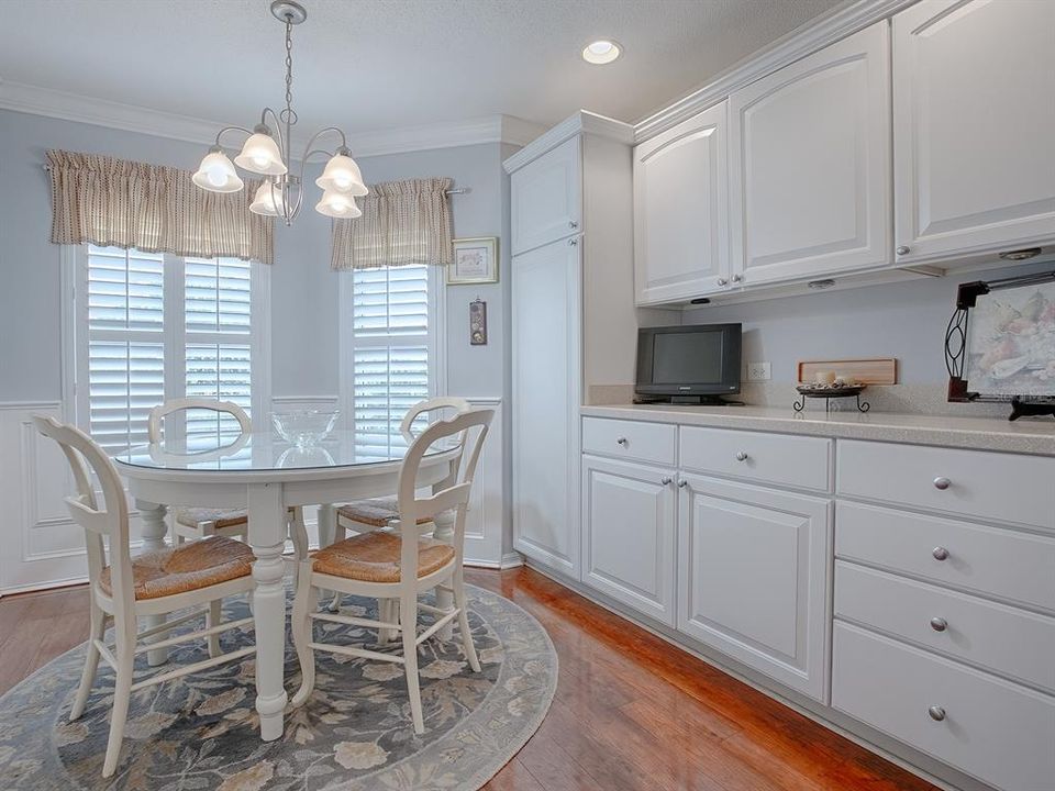 WHAT A GREAT CASUAL DINING AREA AND SO MUCH COUNTER AND CABINET SPACE WITH CLOSET PANTRY. CROWN MOLDING, PLANTATION SHUTTERS, AND BEADBOARD TRIM.