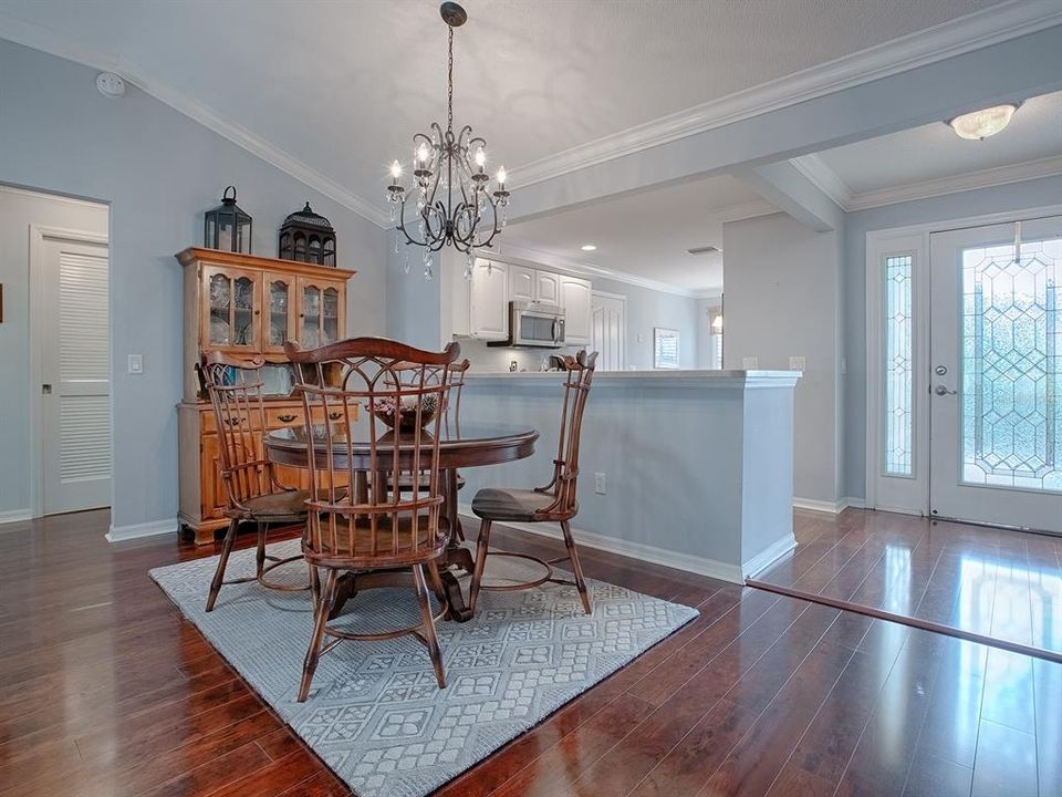 FORMAL DINING ROOM WITH LOVELY CHANDELIER.