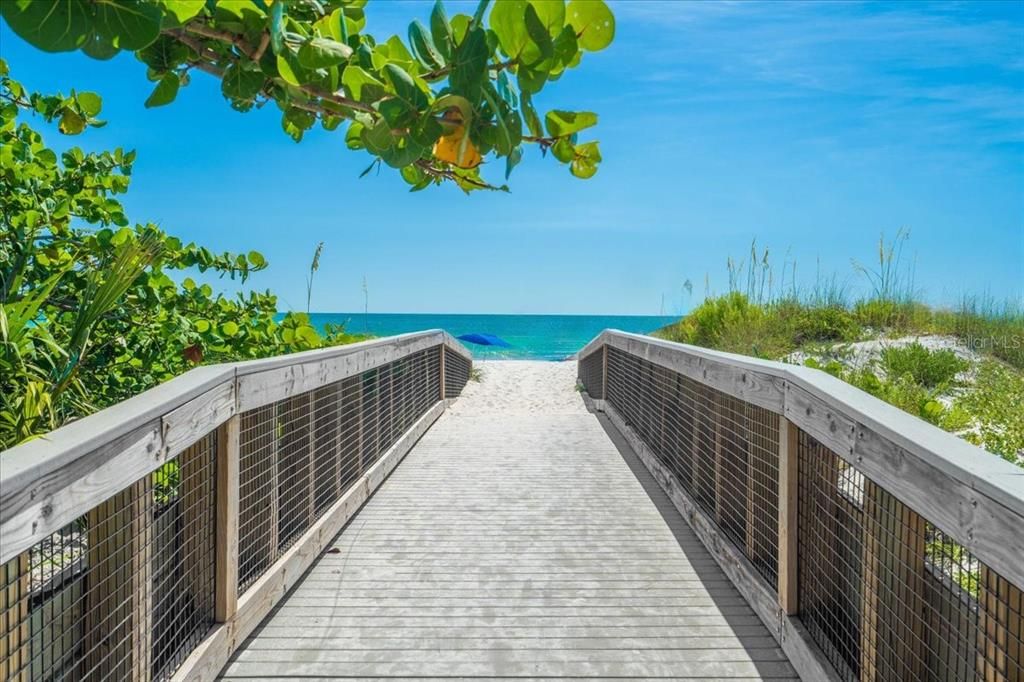 The beautiful beach is just over the bridge.