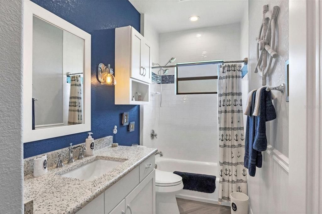 Hall bathroom with quartz countertops